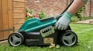 Hand adjusting the lever on a small lawn mower to change the grass cutting height for a spring mow.