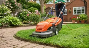 Close up of a Flymo electric hover mower cutting lawn edges