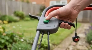 Close-up of the safety power switch and dual lever start on a cheap electric grass cutter