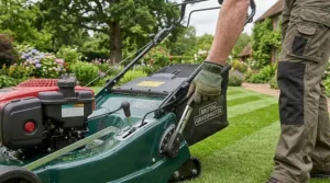 Adjusting the single-point cutting height lever on a petrol lawn mower with roller to change the grass finish.