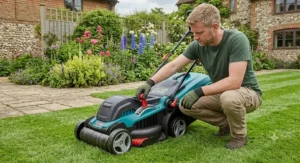 Adjusting the central cutting height lever on a modern electric lawn mower with a roller.