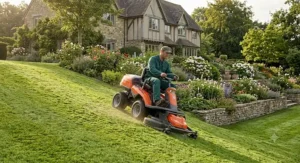 Husqvarna ride on mower with hydrostatic transmission mowing a sloped British garden