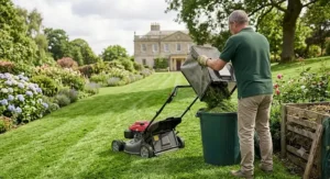 An illustration showing a gardener emptying the high capacity grass catcher of a petrol lawn mower in a big back garden