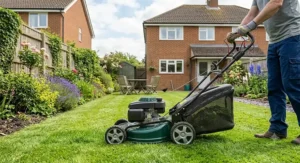 A petrol lawn mower under 300 pounds being used to maintain a typical small to medium-sized UK suburban garden