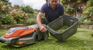Attaching the grass collection box to the rear of the best hover mower.