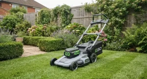 A modern cordless self-propelled lawn mower designed for compact British garden spaces.