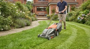 A corded electric lawnmower cutting grass, showcasing the clean cut and convenience for medium-sized gardens.