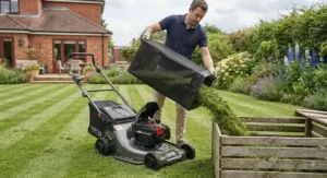 Emptying the grass collection box on a self-propelled lawn mower.