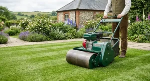 A high-performance petrol cylinder lawn mower featuring a heavy rear roller for classic lawn striping.